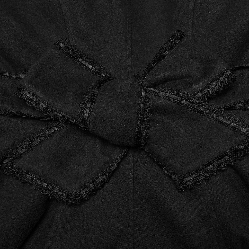 Close-up of elegant black bow detail with lace trim on a women's gothic woolen coat.
