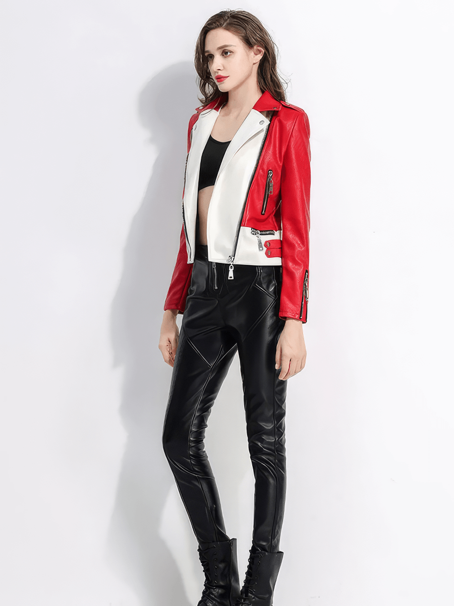Stylish woman in red and white faux leather biker jacket paired with black pants, showcasing rock-inspired fashion.