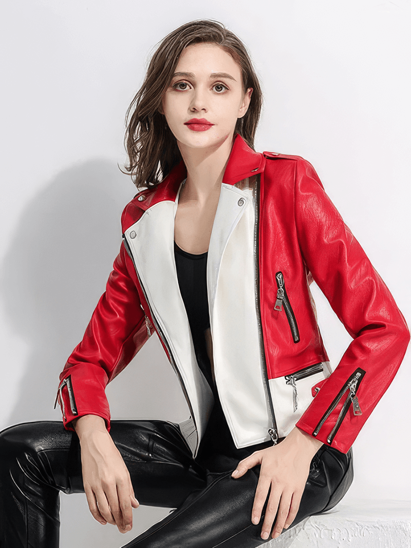 Stylish woman wearing a red and white faux leather biker jacket, exuding rock style and elegance.