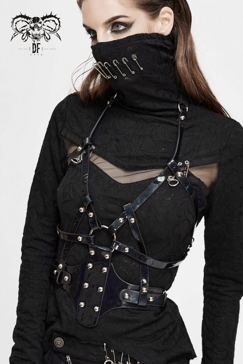 Gothic women's faux leather body harness with silver fittings, perfect for cosplay and edgy fashion.