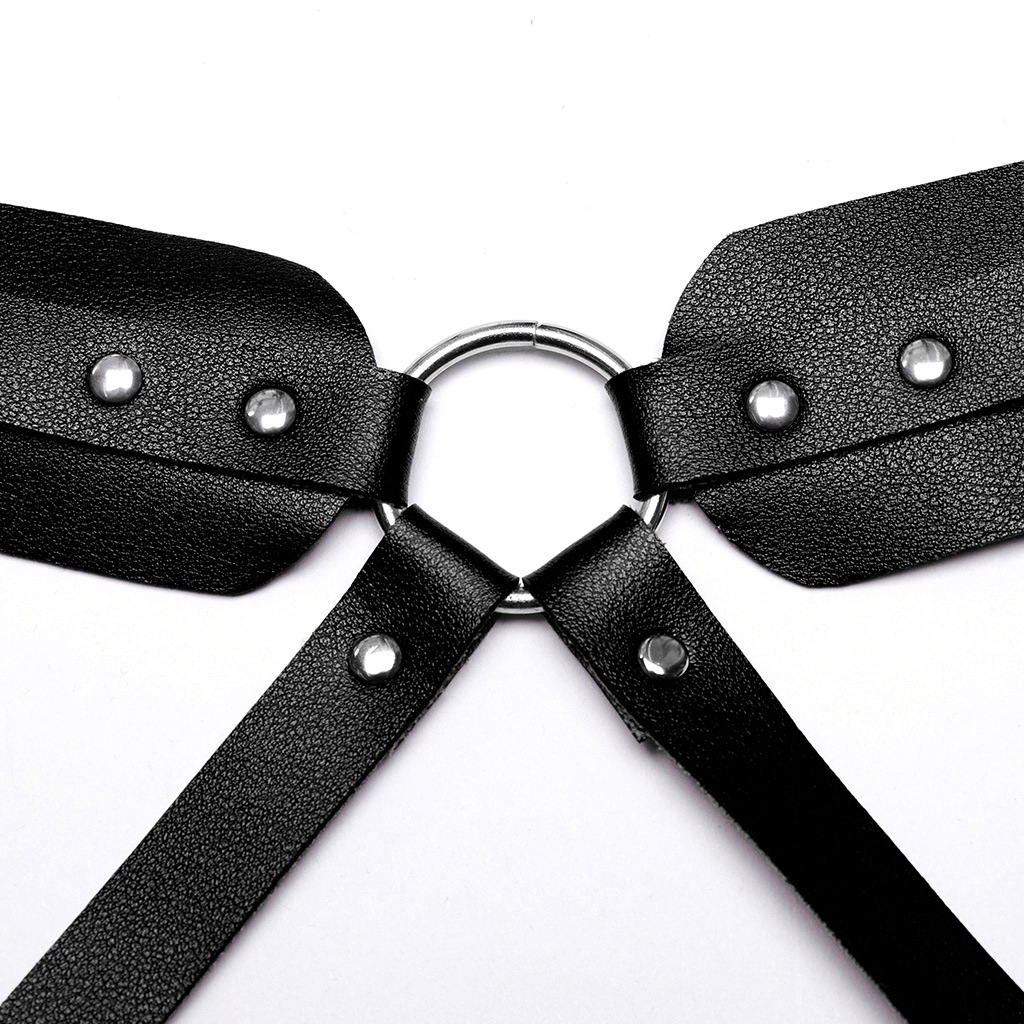 Close-up of women's faux leather gothic strappy harness with metal ring and adjustable loops for an edgy punk look.