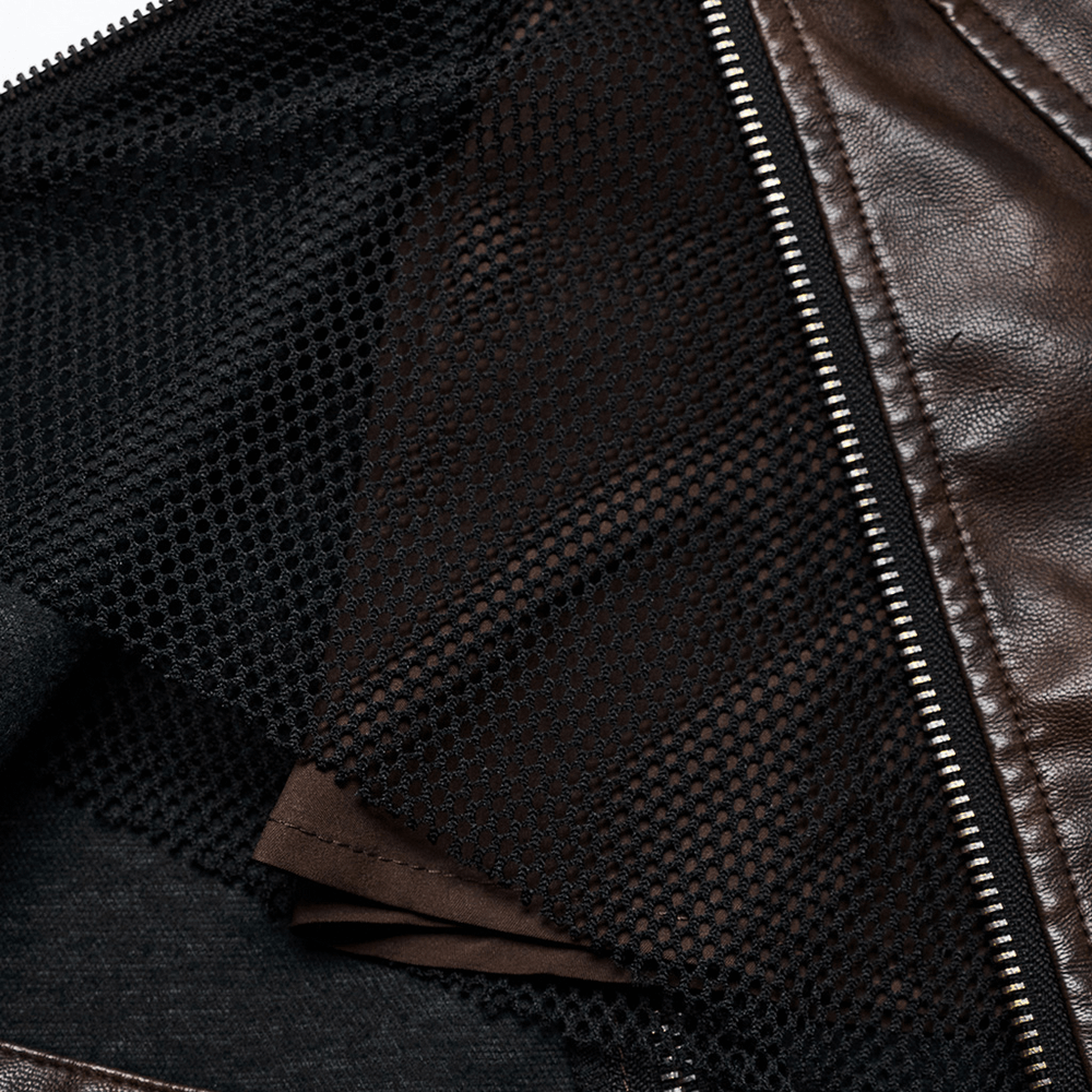 Close-up of the interior showing the mesh design and zipper of a coffee faux leather mini skirt.