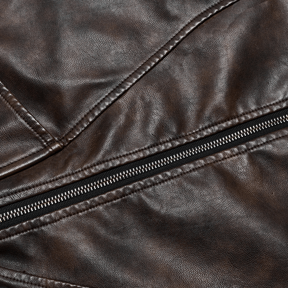 Close-up of coffee faux leather fabric featuring a stylish zipper for a mini skirt.