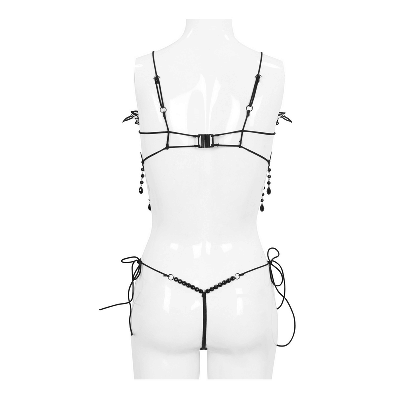 Back view of women's gothic black lingerie set featuring lace, cross straps, and beaded accents.