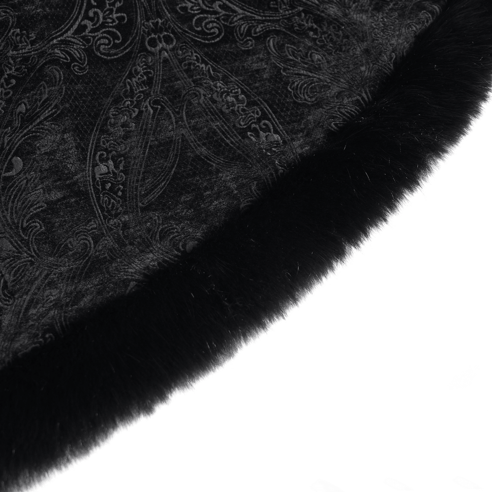 Close-up of elegant black coat fabric featuring paisley patterns and luxurious fur trim detail.