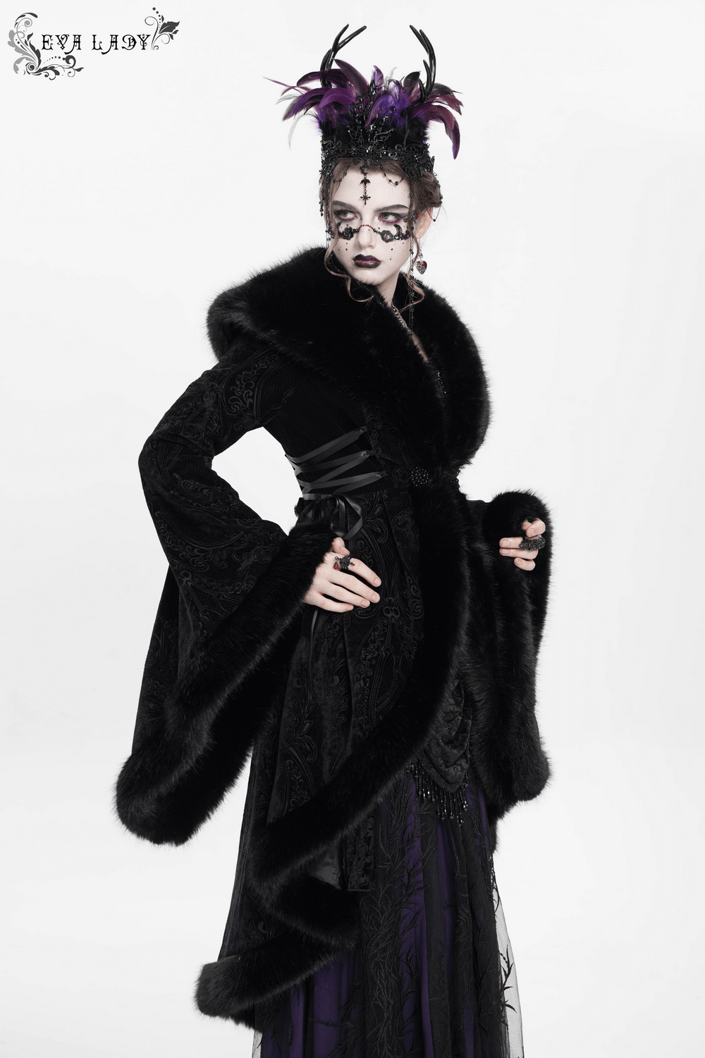 Elegant Gothic woman in black fur-trimmed coat with lace-up waist and dramatic headdress.