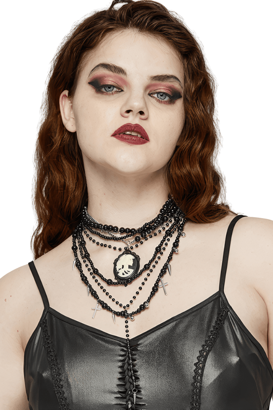 Gothic black beaded necklace with cross pendants, layered design and skull cameo worn by a model.