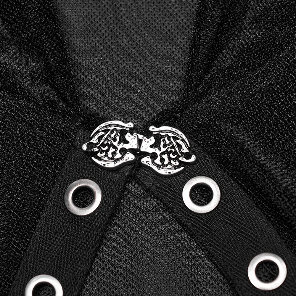 Close-up of intricate eyelet and decorative fastening on a women's gothic black hooded lace cape.