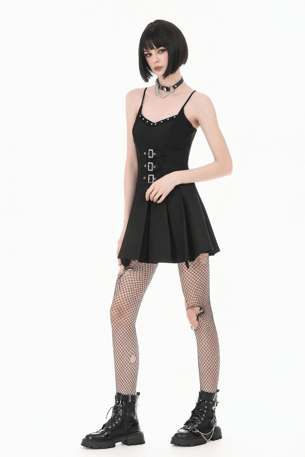 Women's Gothic Buckle Corset Mini Dress with Pleated Skirt styled with fishnet tights and platform boots.