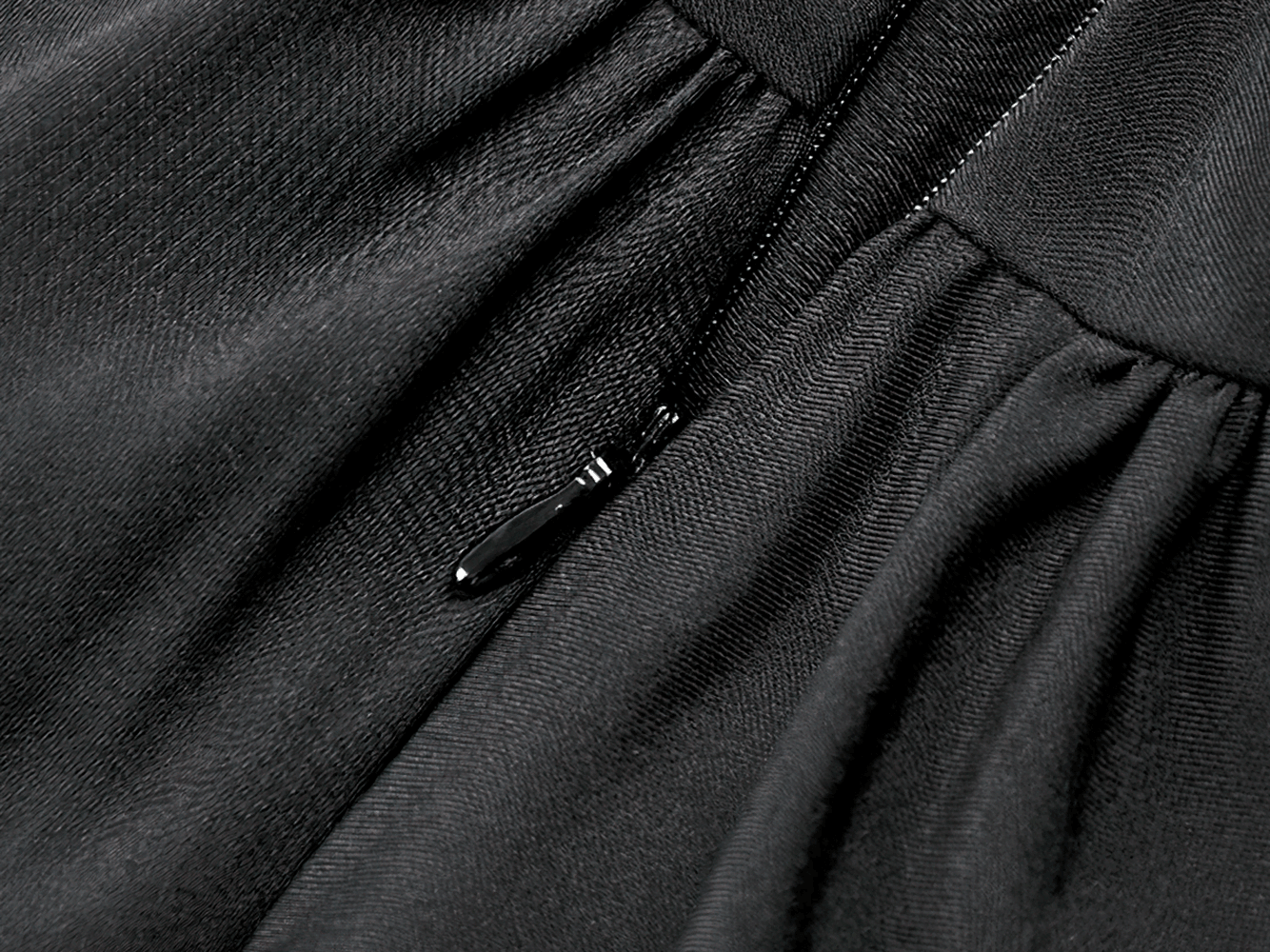 Close-up of the zipper detail on the Women's Gothic Cold Shoulder Mini Dress with Lace Sleeves, showcasing luxurious black fabric.