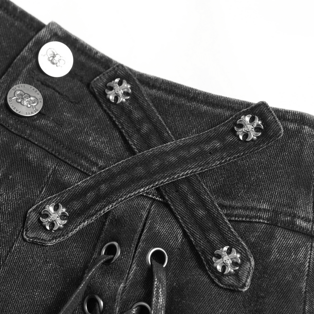Close-up of Women's Gothic Denim Skirt with Lace-Up Strap Details showcasing metal buttons and lace-up straps.