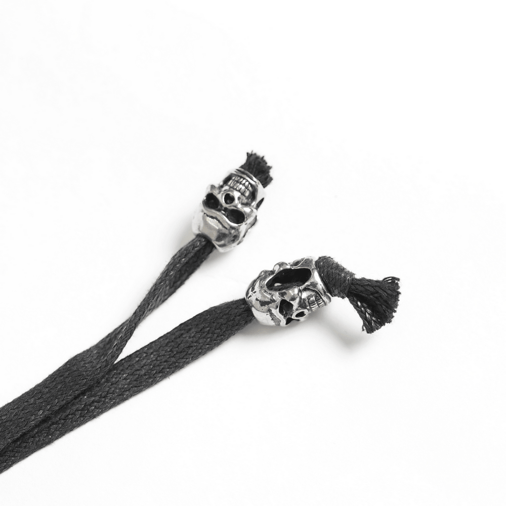 Skull lace ends for Women's Gothic Denim Skirt with Lace-Up Strap Details, adding punk flair to your look.