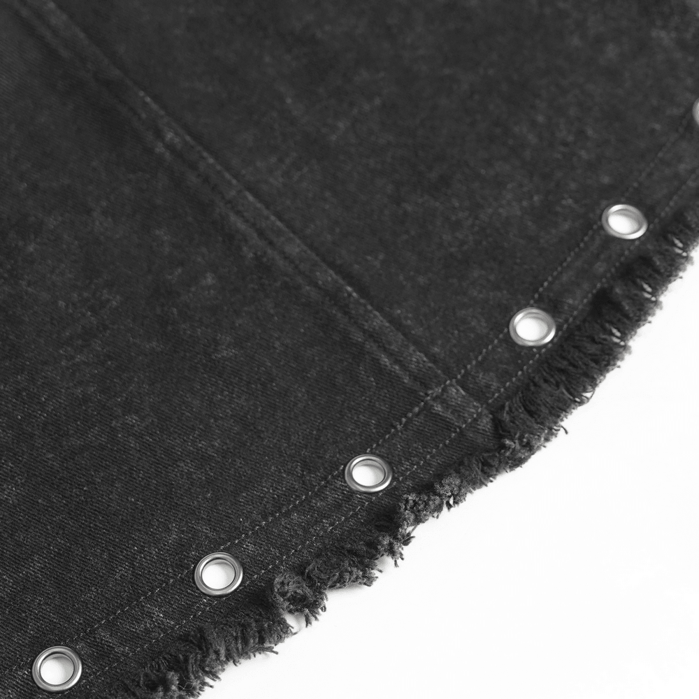 Close-up view of Women's Gothic Denim Skirt with Lace-Up Strap Details featuring grommet hem and distressed edge.