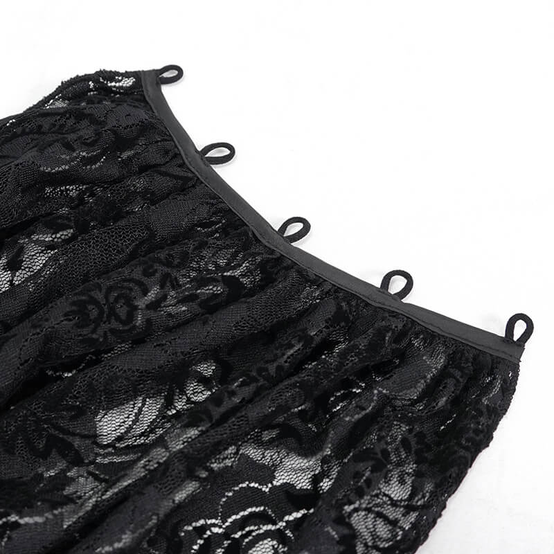 Close-up of elegant black lace detailing with loops, perfect for gothic fashion and vintage style.