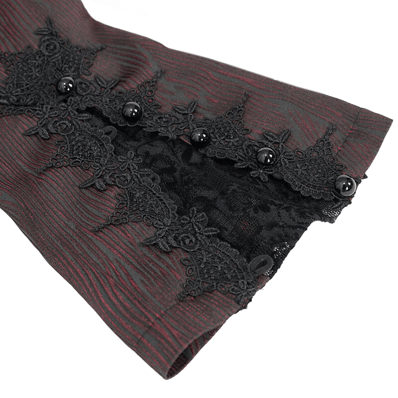 Close-up of women's gothic flare sleeved jacket showing intricate lace and button detail in wine red and black.