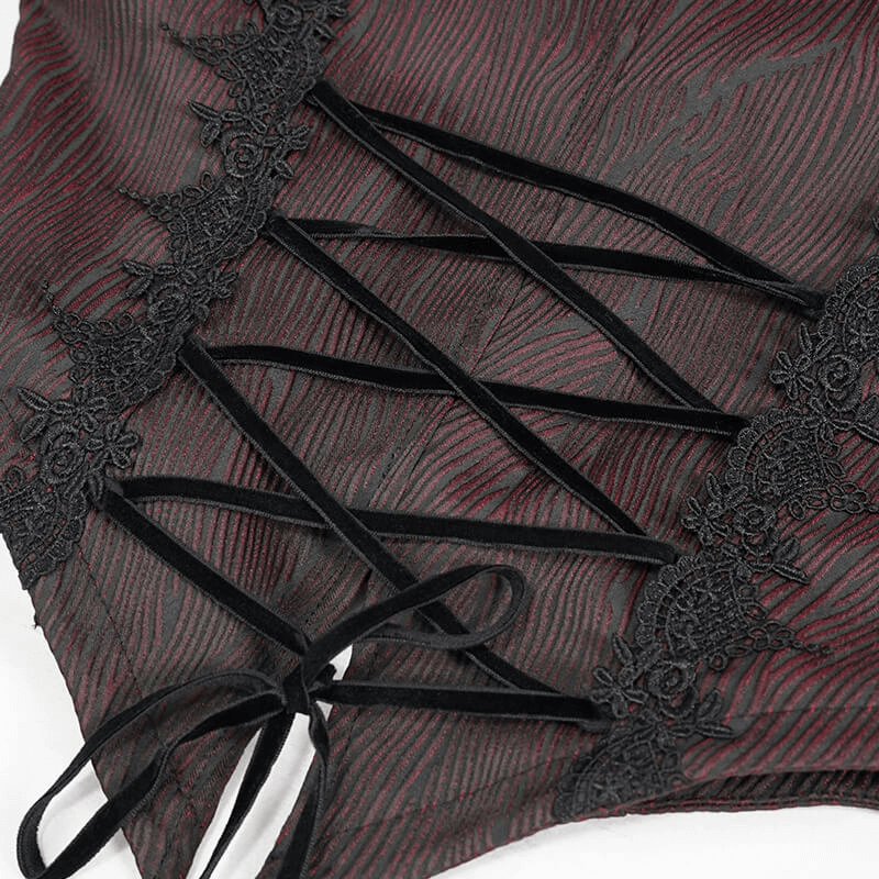Close-up of women's gothic wine red jacket fabric showing lace inserts and ribbon detail for a vintage look.