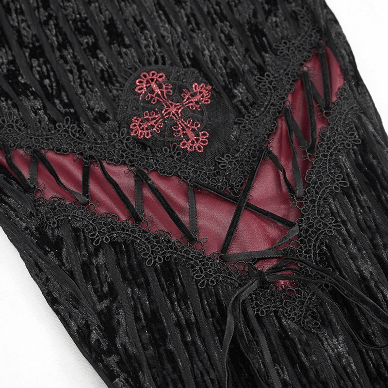 Close-up of women's gothic flare pants featuring lace and burgundy inserts, highlighting intricate design and texture.