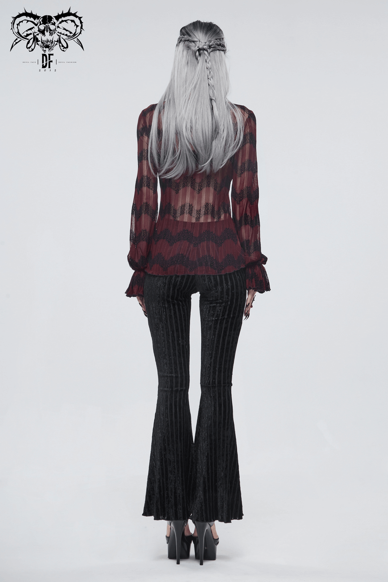Model wearing women's gothic flared pants with lace & burgundy accents, showcasing a stylish black design from the back.