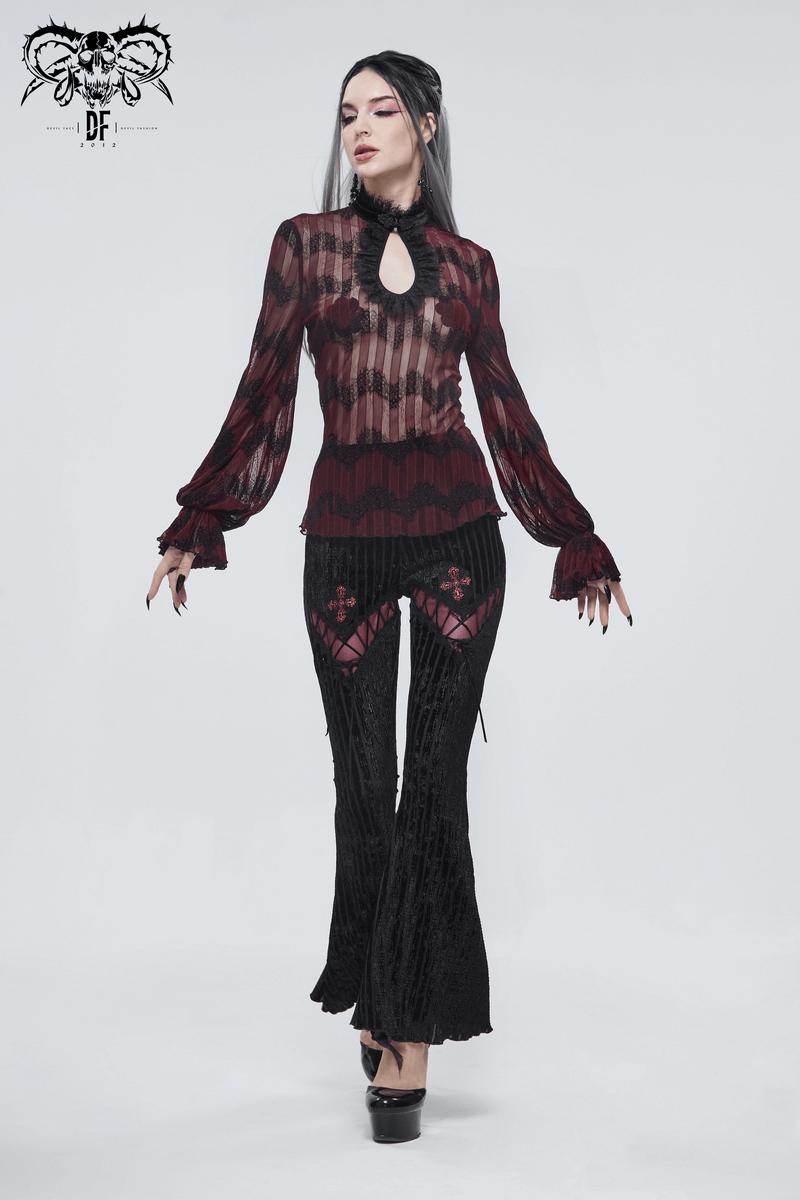 Stylish gothic model in lace-accented black flared pants paired with a burgundy top, showcasing a chic gothic flair.