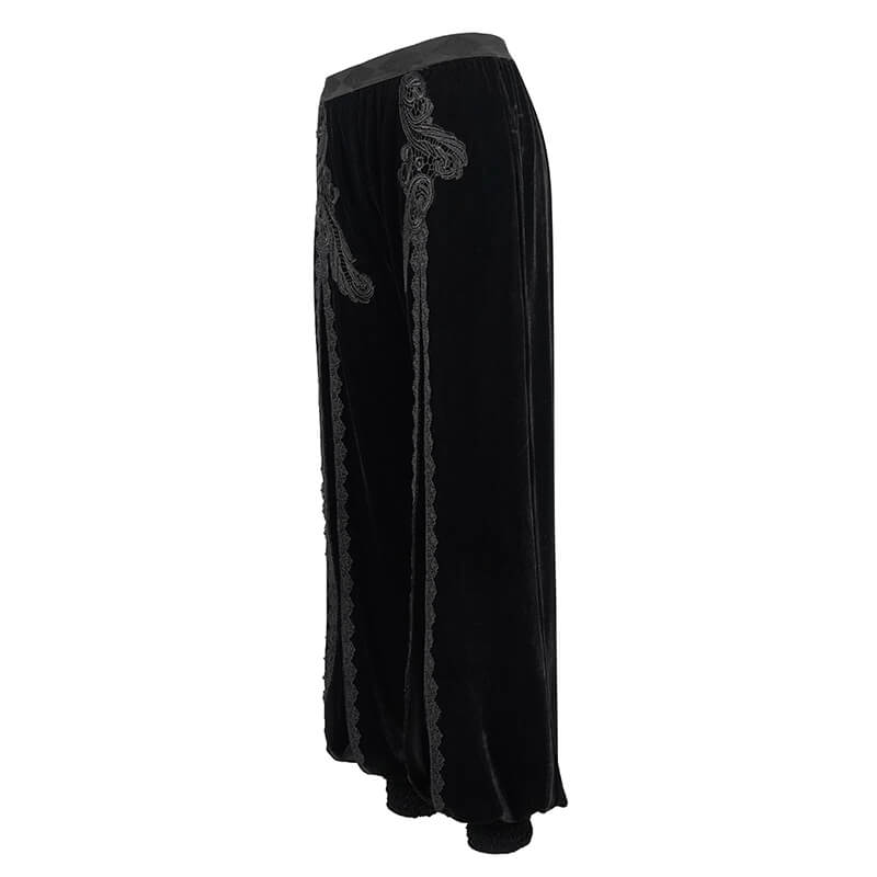 Women's gothic black velvet flared pants with elegant lace inserts highlighting vintage style.