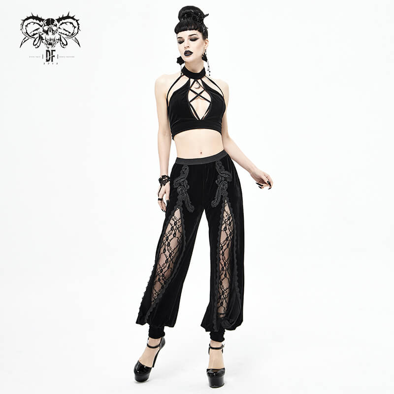 Gothic style model wearing black velvet flared pants with lace inserts and matching crop top, showcasing a trendy look.
