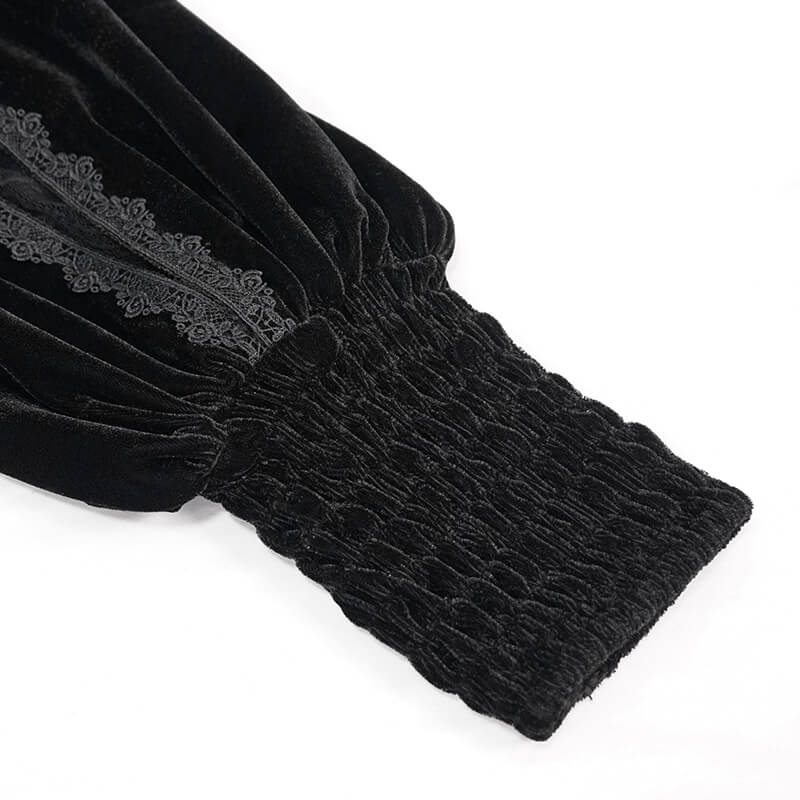 Detail of black velvet fabric with elasticated cuff and lace embroidery, perfect for gothic style outfits.