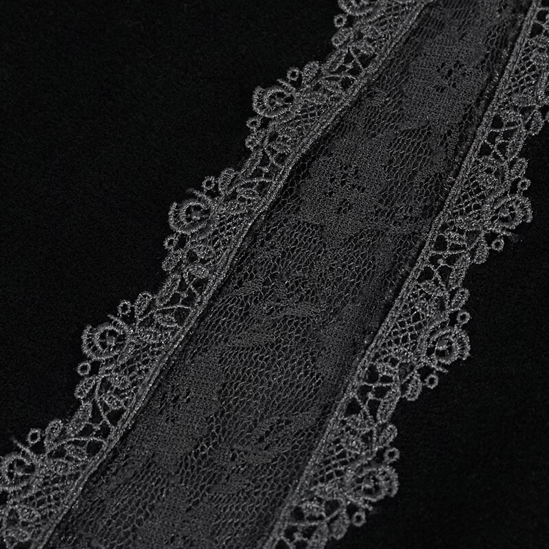 Close-up of elegant black lace detailing on velvet fabric, showcasing gothic style fashion.