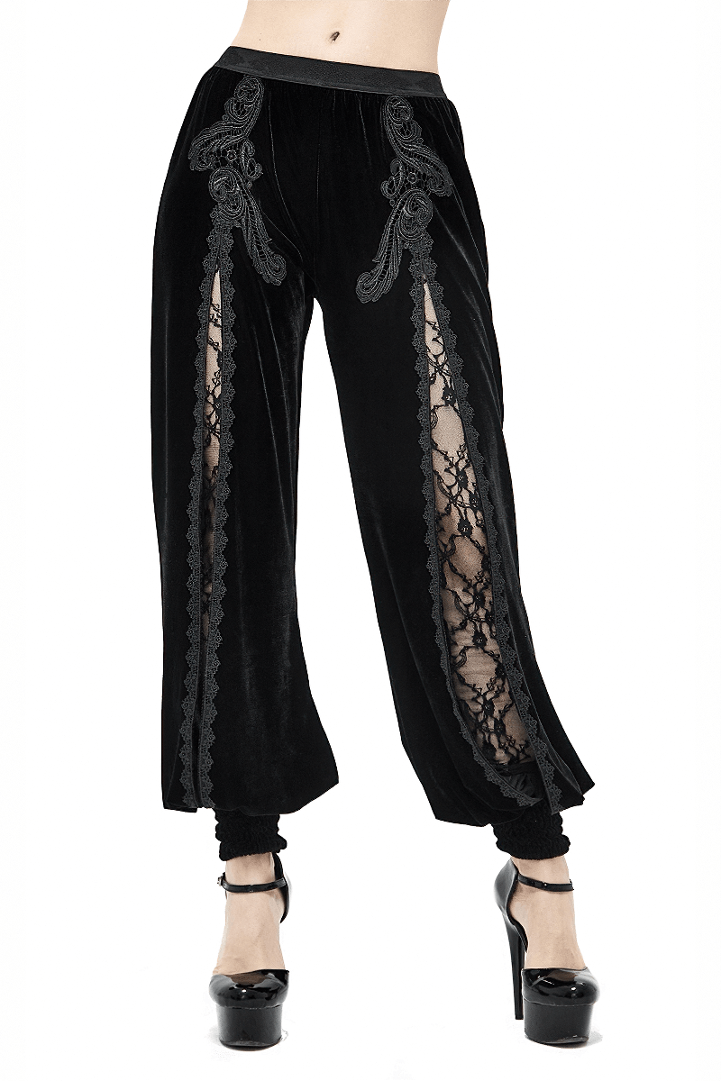 Women's black velvet flared pants with lace inserts in gothic style for a fashionable vintage look.