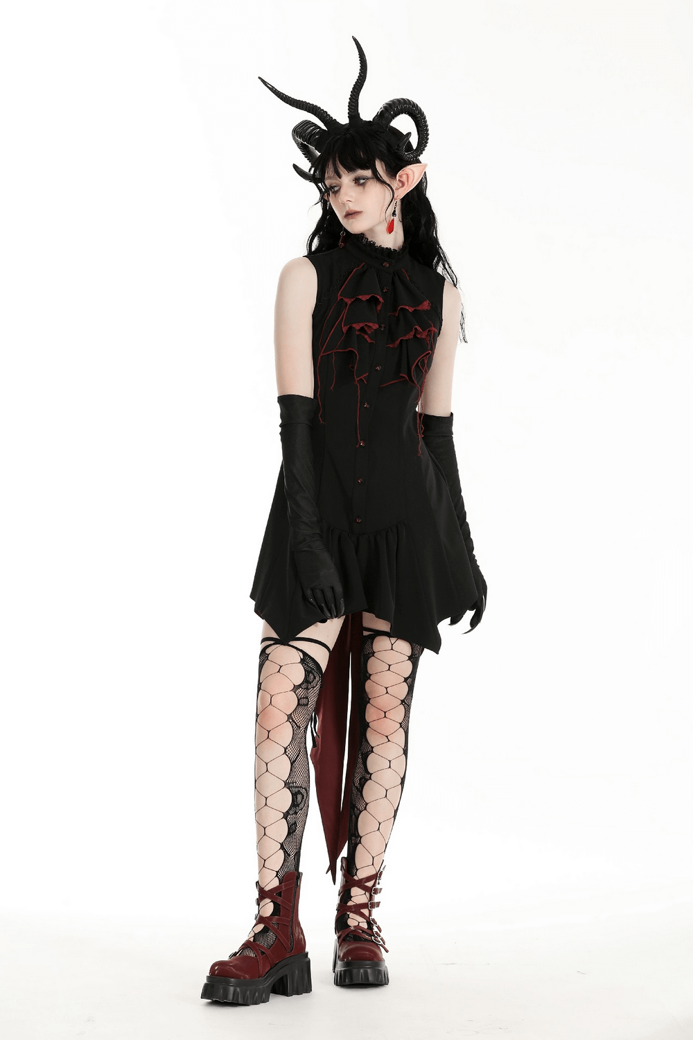 Gothic high-low dress with ruffles, black and red accents, paired with fishnet stockings and dramatic accessories.