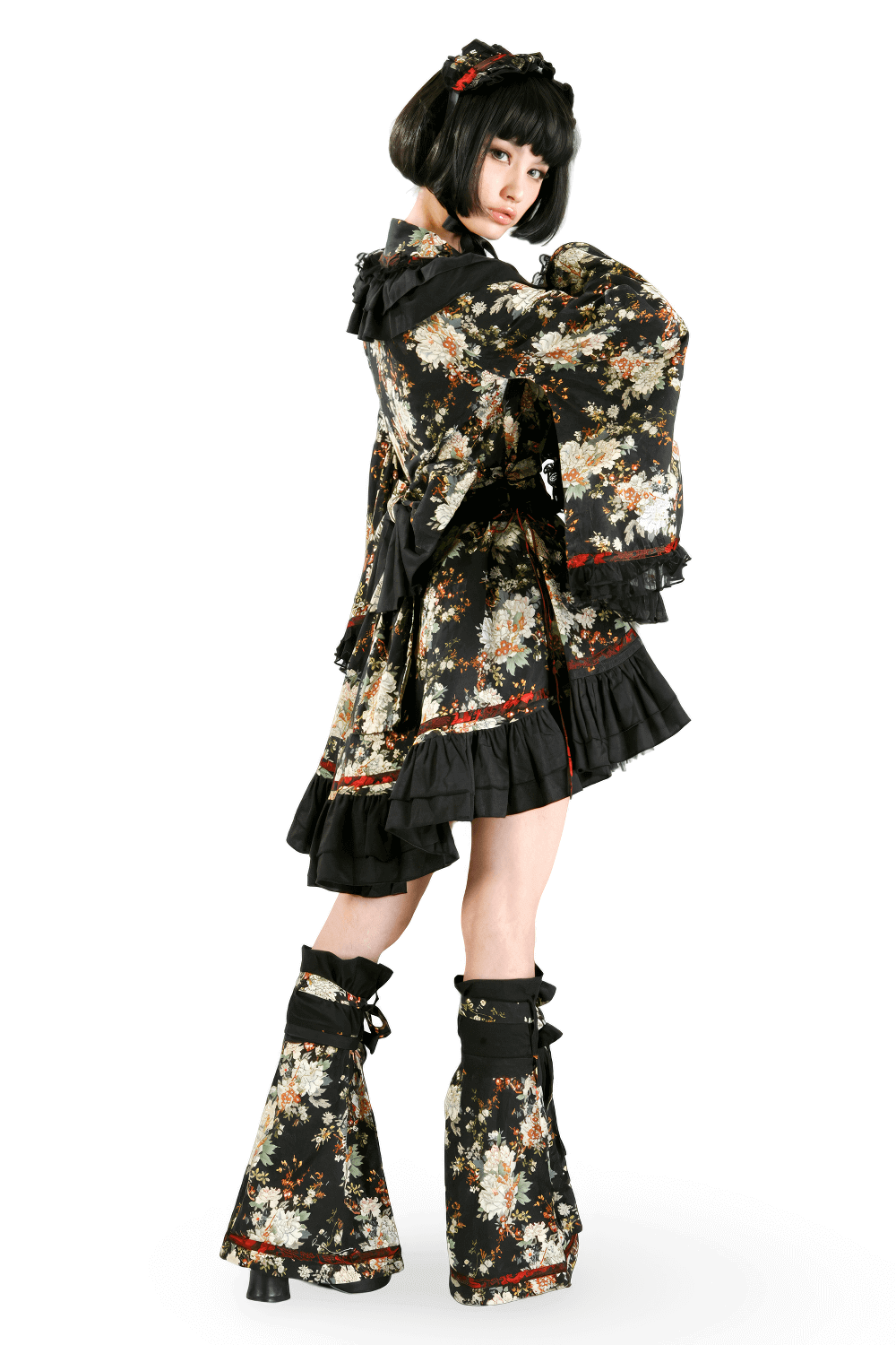 Elegant woman in black floral Gothic-inspired Lolita dress with ruffles and leg decoration, perfect for themed events.