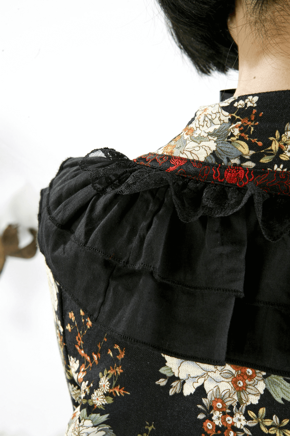 Close-up of ruffled neckline on a Women's Gothic Floral Lolita Dress highlighting intricate lace details.