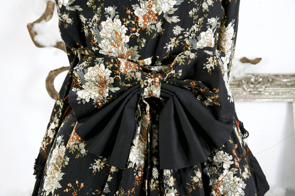 Back view of Women's Gothic Inspired Black Floral Lolita Dress showcasing elegant floral patterns and a stylish bow.