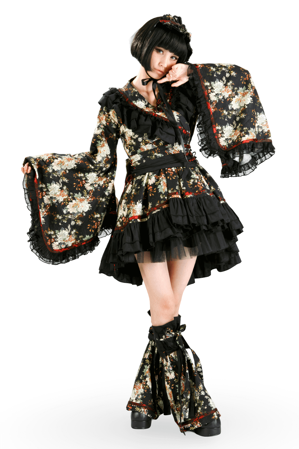 Woman in black floral Gothic Lolita dress with ruffles and lace, perfect for themed events and cosplay.