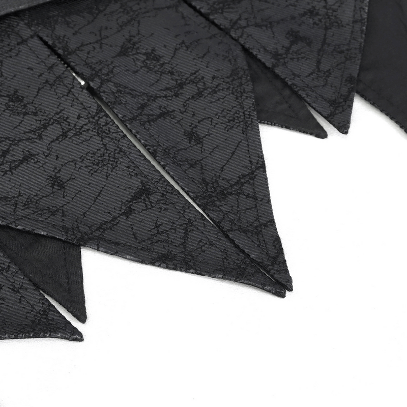 Close-up of black gothic fabric with irregular pointed edges, perfect for a unique waistcoat design.