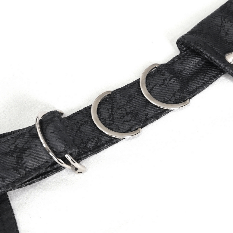 Close-up of the intricate lace-up detailing on a women's gothic waistcoat, showcasing silver rings on a black fabric.