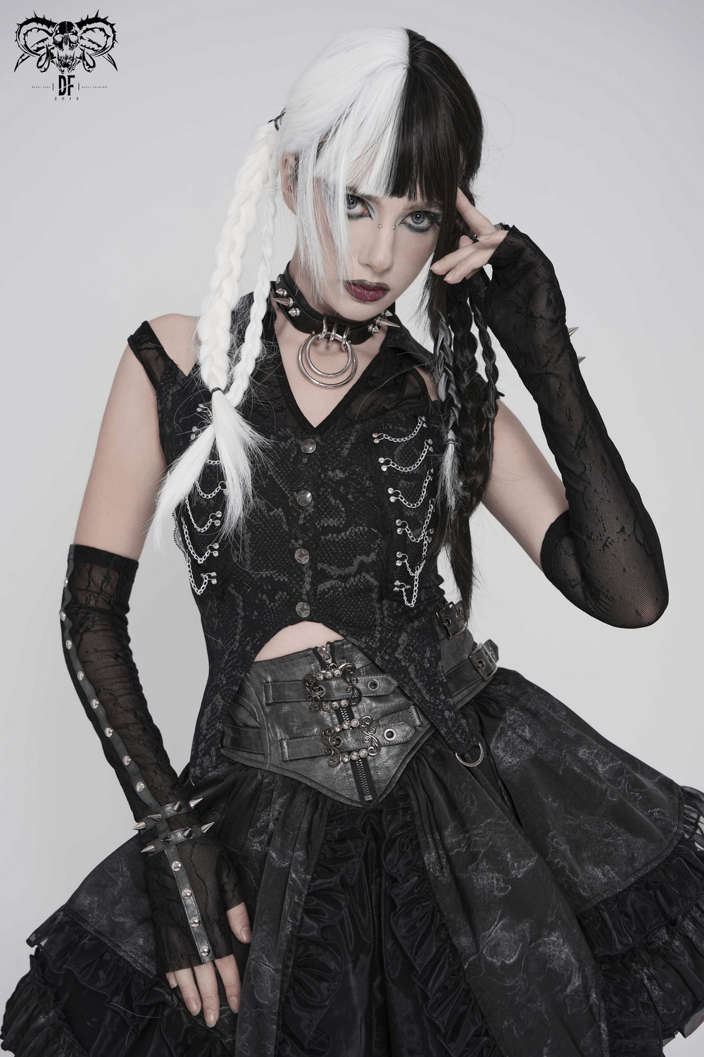 Model showcasing Women's Gothic Lace Arm Sleeves with Spike Stud Cuffs in a stylish dark outfit.