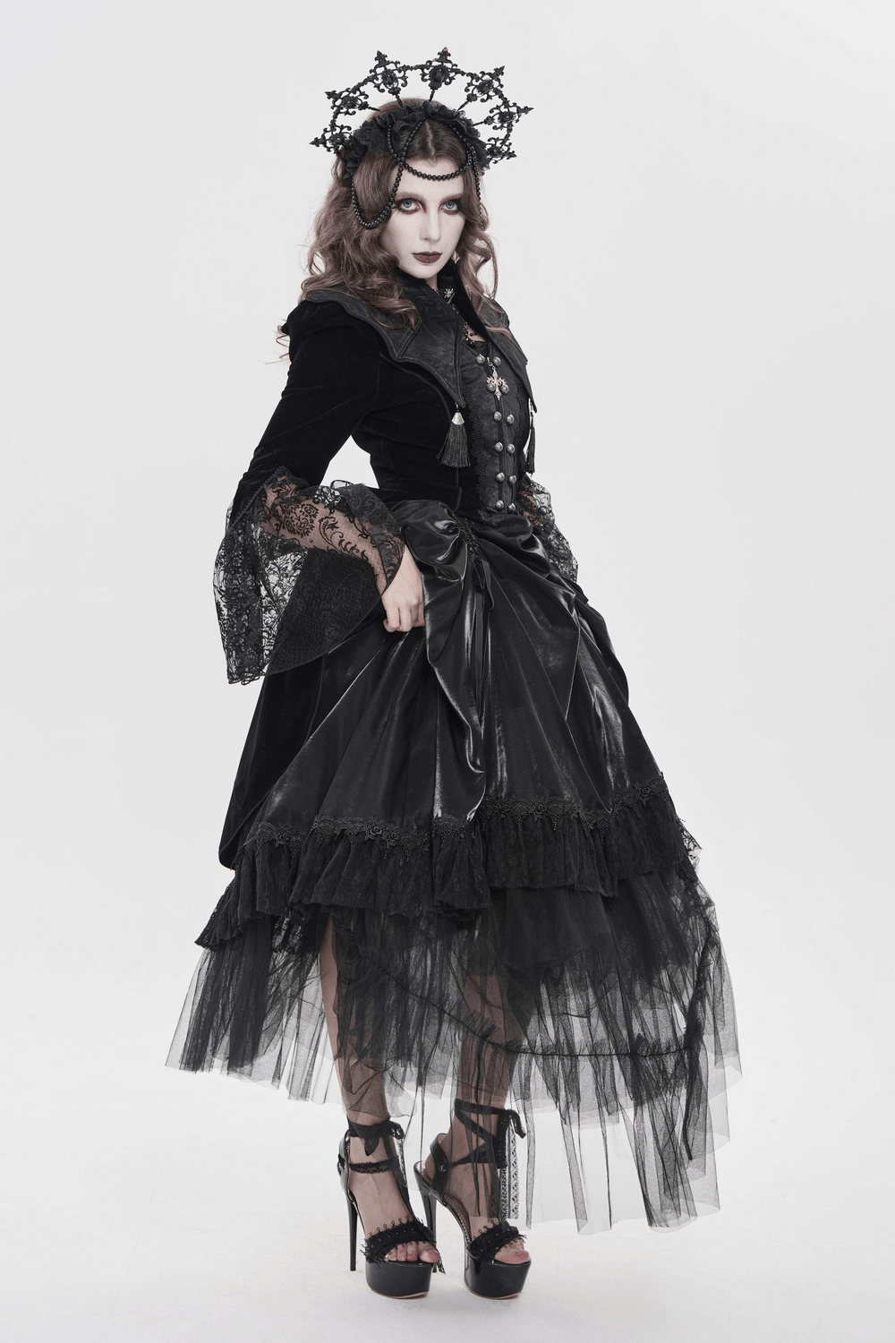 Women's Gothic Lace Bell Sleeve Tailcoat Jacket modeled by a model in a dramatic all-black outfit with lace details.