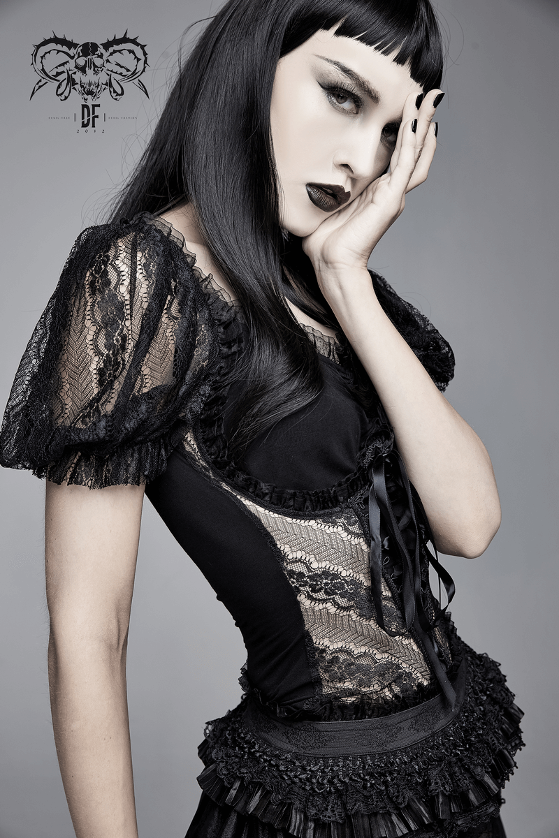 Stylish woman in a black gothic lace slim T-shirt showcasing puff sleeves and lace mesh inserts.