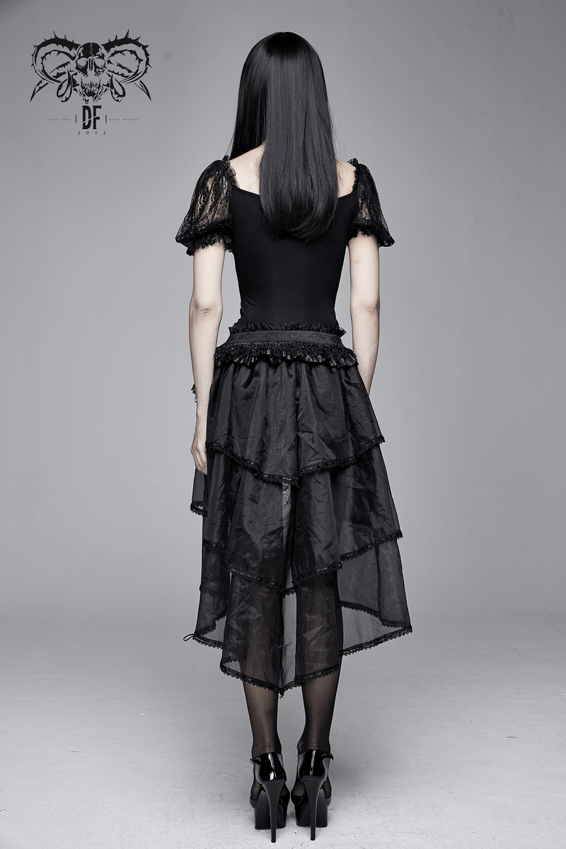 Gorgeous back view of a woman in a gothic black lace puff sleeve slim t-shirt paired with a flowing black skirt.