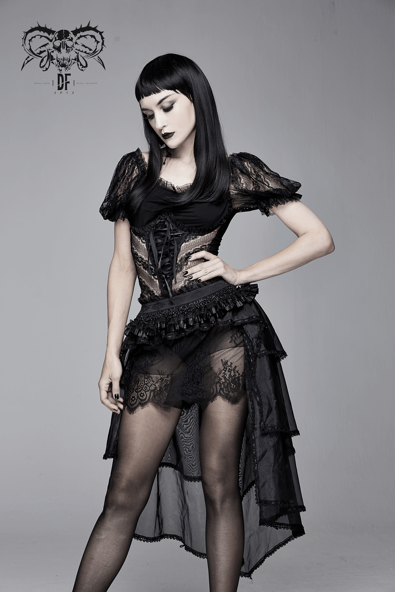 Elegant woman in a gothic black lace T-shirt and stylish layered skirt, showcasing a chic vintage look.