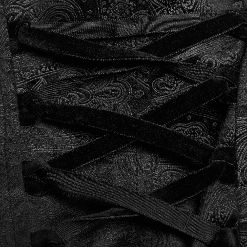 Close-up of the lace-up back detail on a women's gothic long coat with textured black fabric.