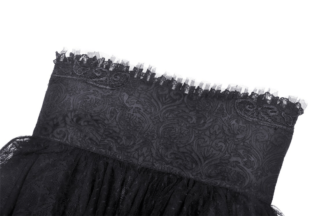 Close-up of the intricate lace detailing on the waistband of a women's gothic skirt.