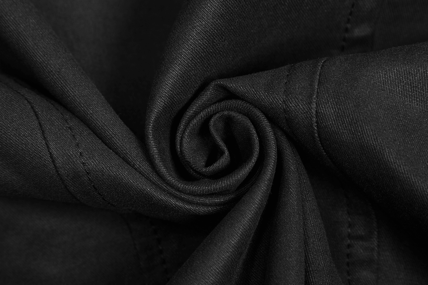 Close-up of luxurious black twill fabric, showcasing its soft texture and intricate weave for a vintage-inspired look.