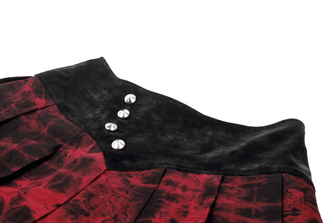 Close-up of women's black and wine red gothic mini skirt with edgy button details and pleats.