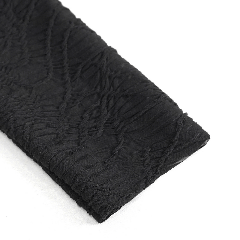 Close-up of soft black textured fabric, perfect for gothic patchwork clothing and alternative fashion styles.