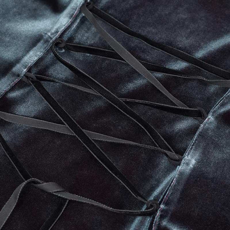 Close-up of gothic puff sleeve shirt showing intricate lace-up detailing with black ribbons on soft velvet fabric.