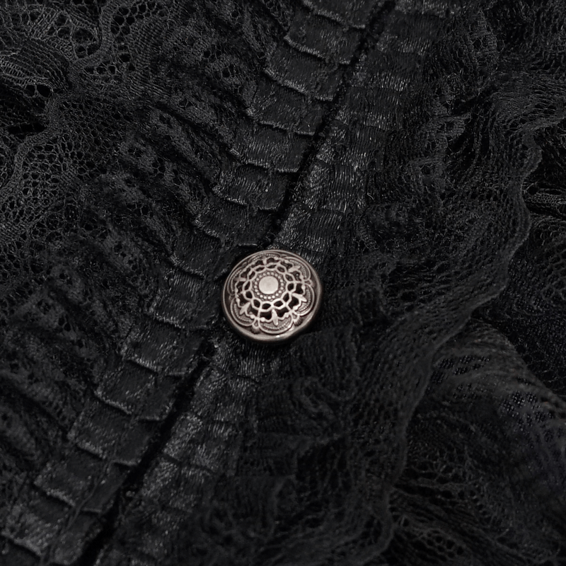 Close-up of a decorative button on a black gothic shirt with lace detail.