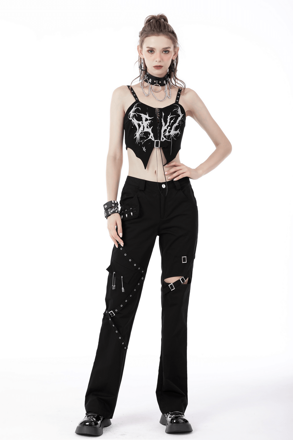 Edgy model wearing a Women's Gothic Punk Crop Top with lace-up front and black cargo pants.