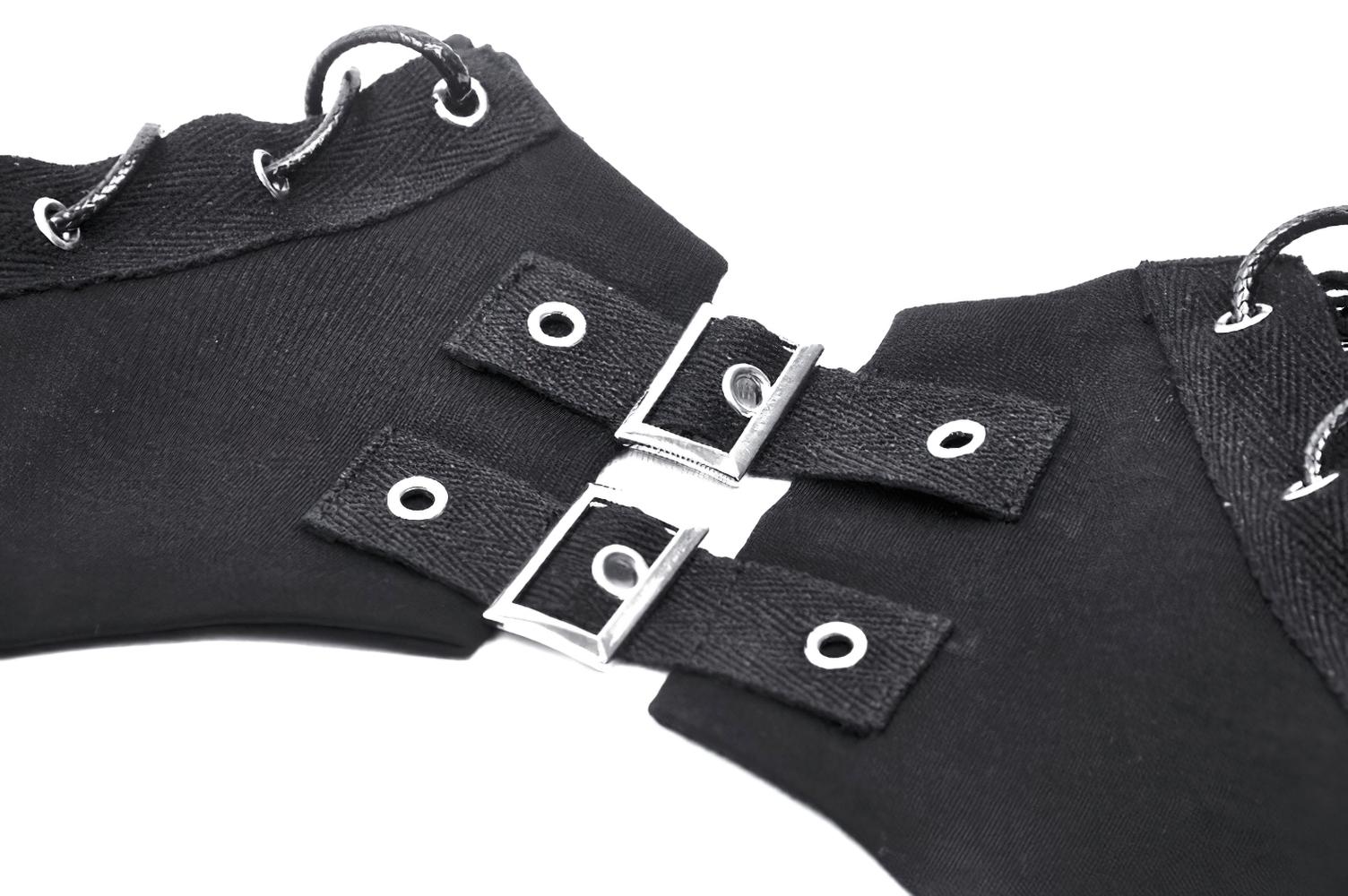 Close-up of black mesh cutout top detailing with eyelets and buckles for a gothic punk style.