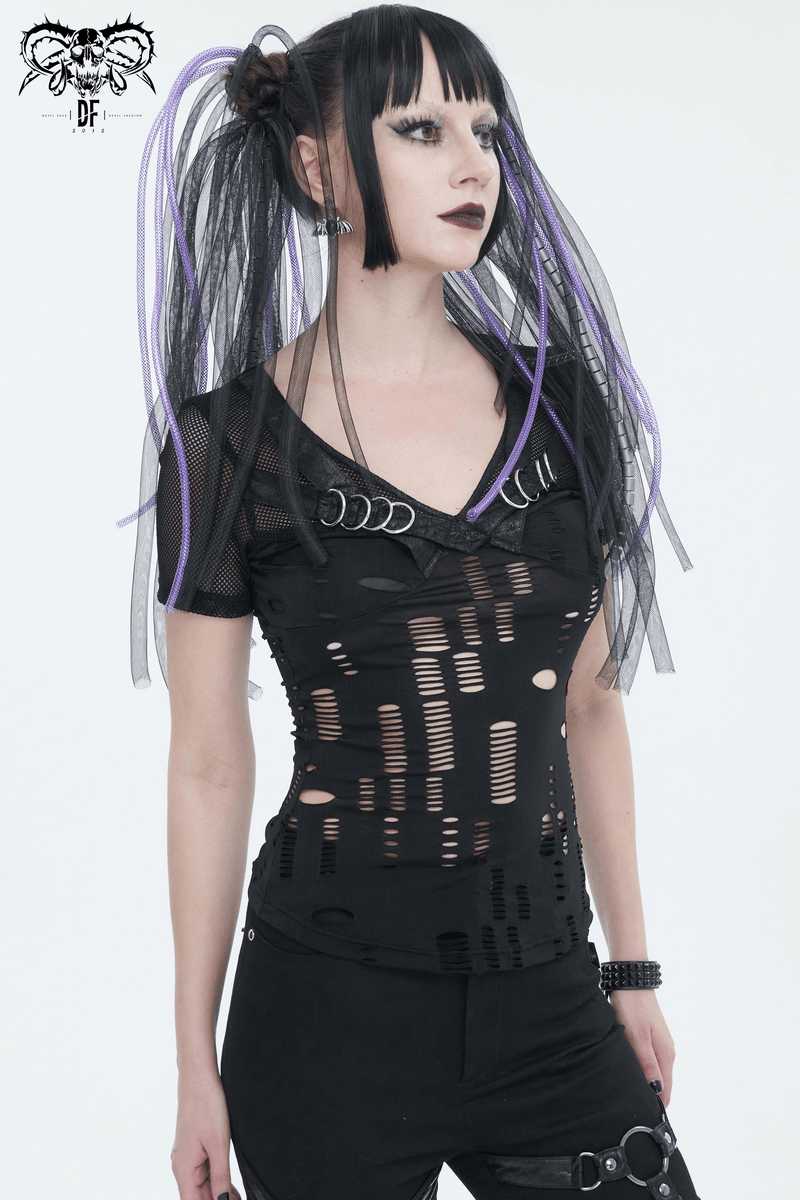 Woman in a black ripped mesh T-shirt with punk features and bold aesthetic, showcasing a daring style.